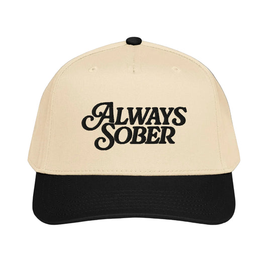 a bone colored hat with black writing and a black brim 